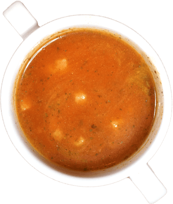 Weiße Tasse mit Tomatensuppe