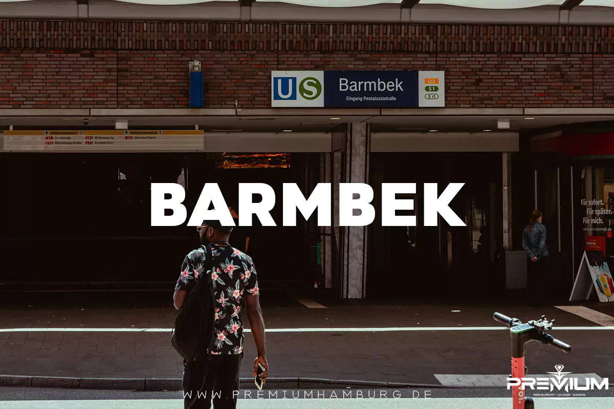 Ein Mann betritt die U-Bahn-Station Barmbek in Hamburg, nahe der lokalen Shisha Bar Barmbek, überlagert von großem Text „BARMBEK“ und der Webadresse.